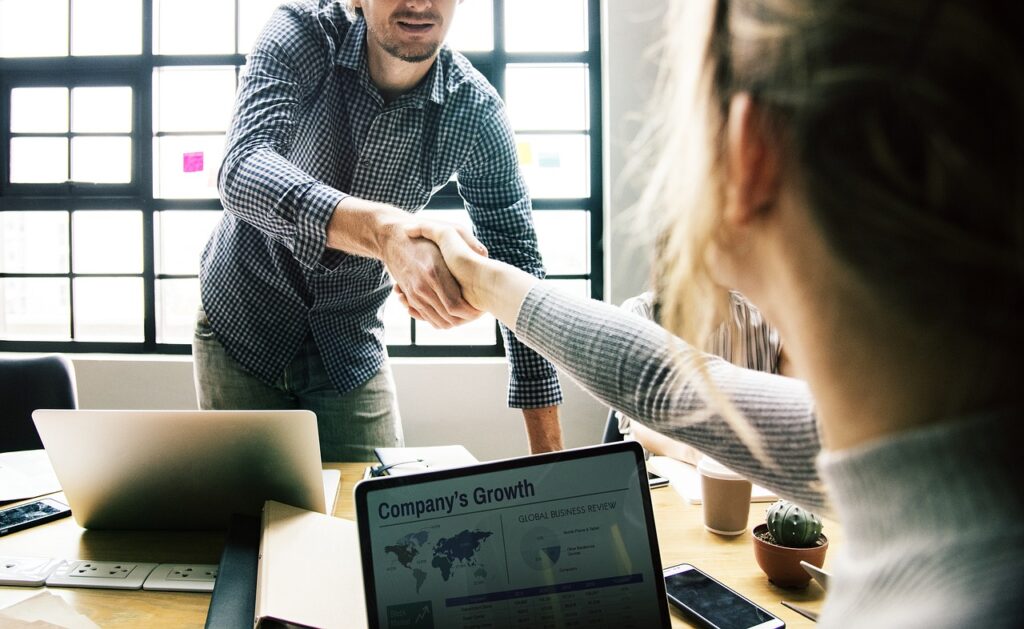 coworkers shaking hands