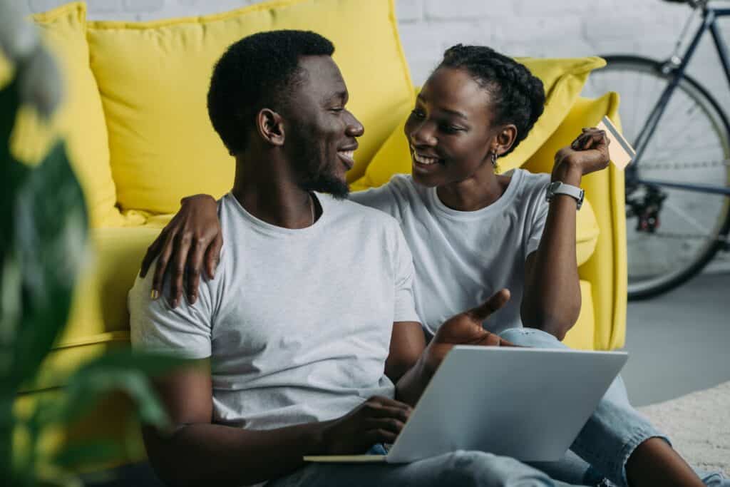 Couple smiling and relaxed as they discuss their debt relief options