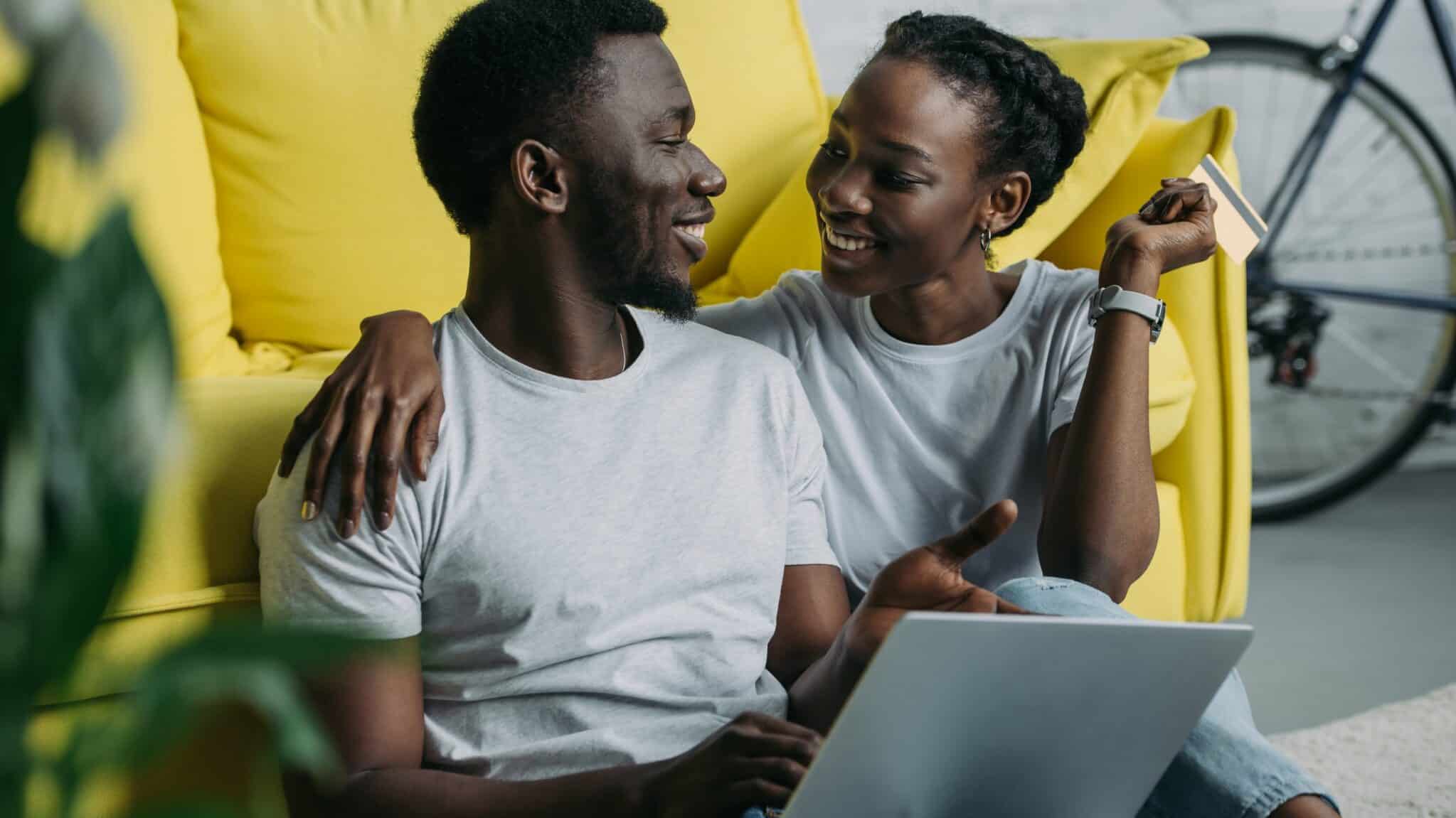 Couple smiling and relaxed as they discuss their debt relief options