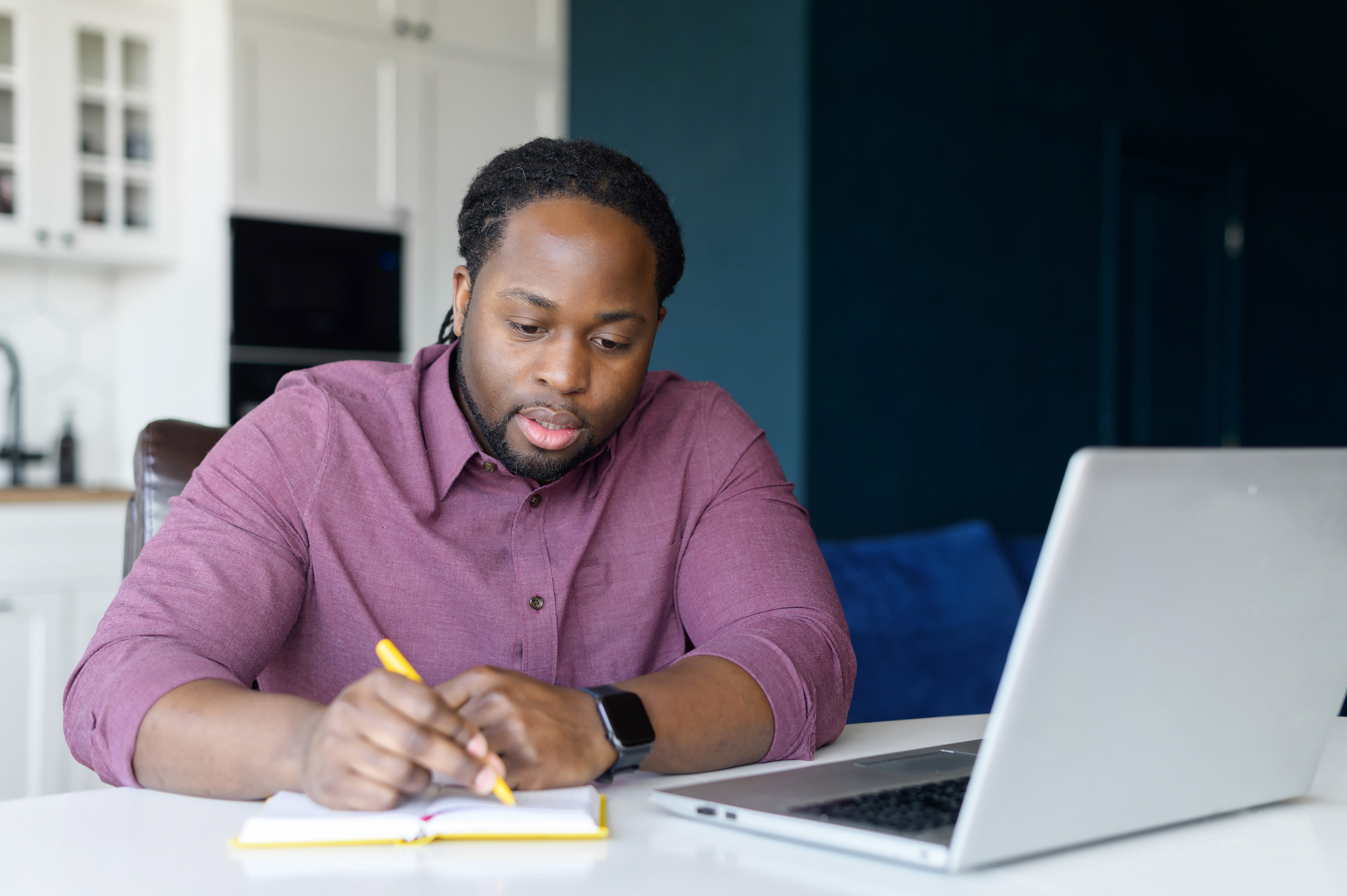 Adult man taking a personal finance course online