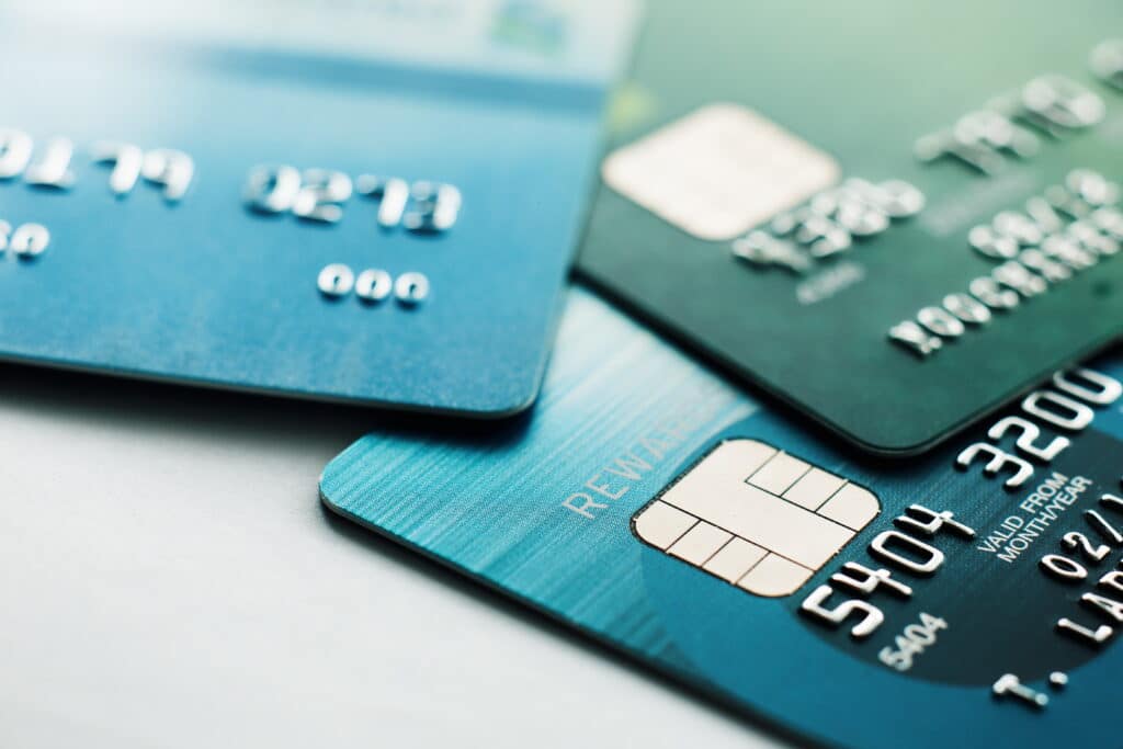 Three credit cards displayed side by side on a flat surface