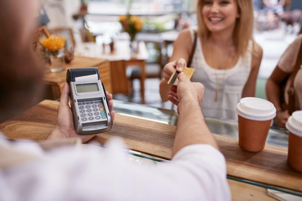 customer shopping at coffee shop with credit card