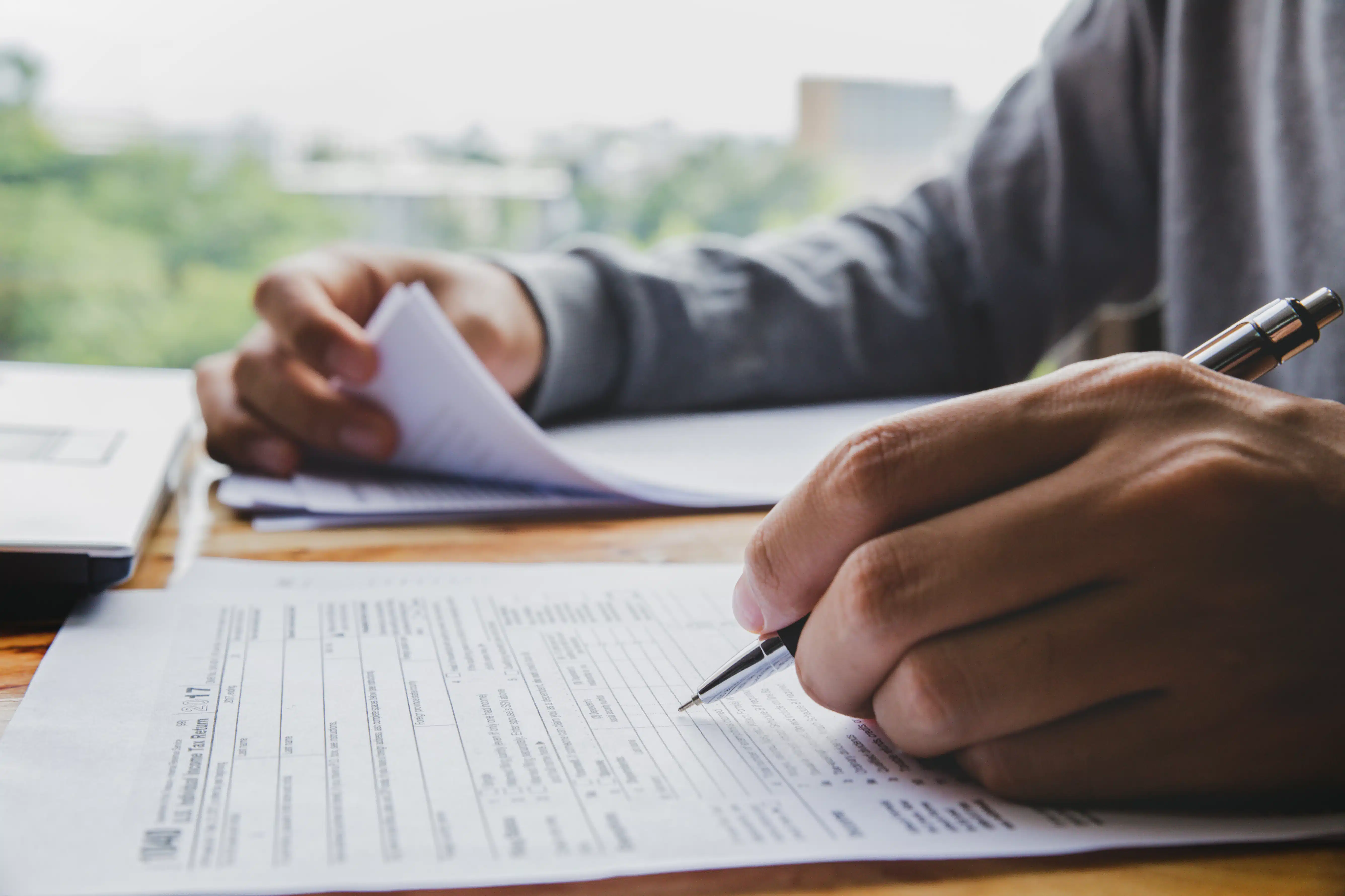 A person reviewing tax documents and payment options