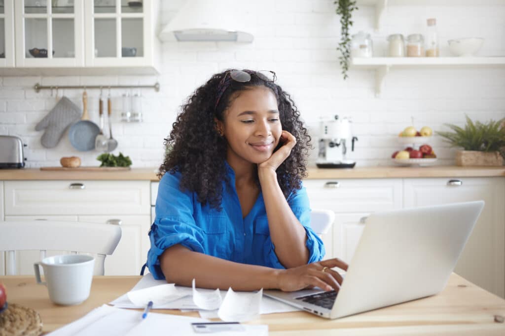 woman satisfied expression paying debt off