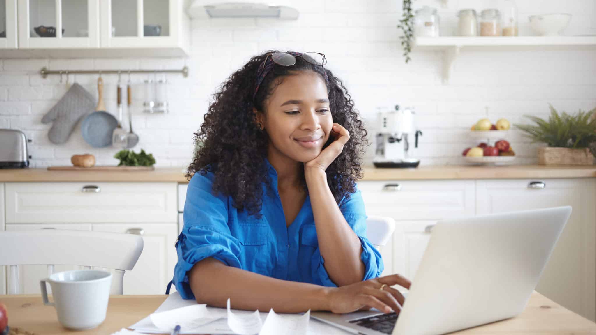 woman satisfied expression paying debt off