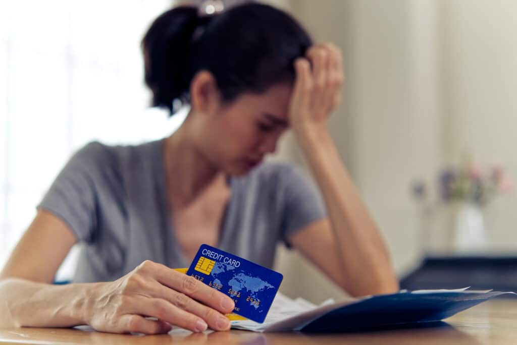 Stressed woman dealing with her credit card debt