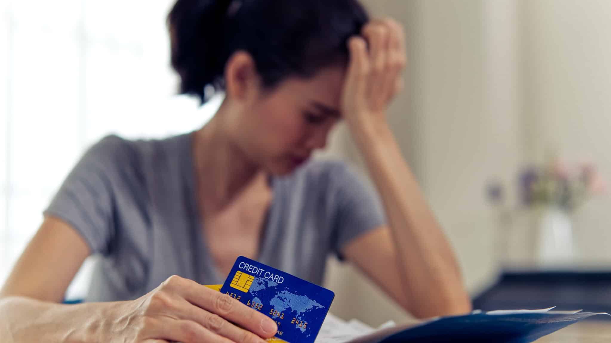 Stressed woman dealing with her credit card debt