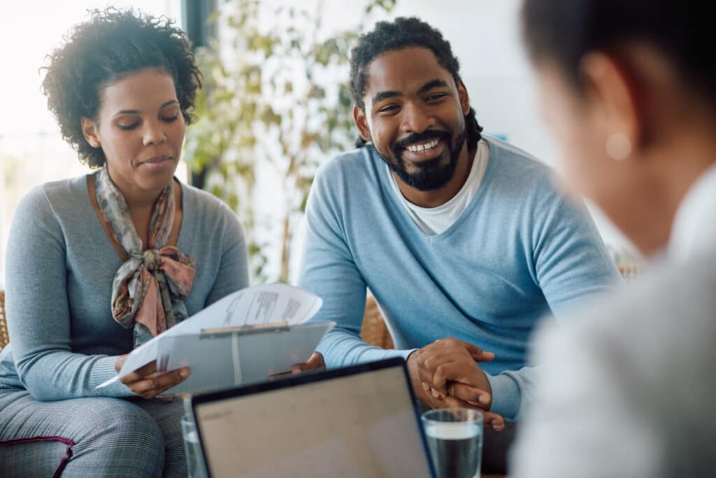 Happy Couple Reviewing Their Finances