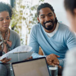 Happy Couple Reviewing Their Finances