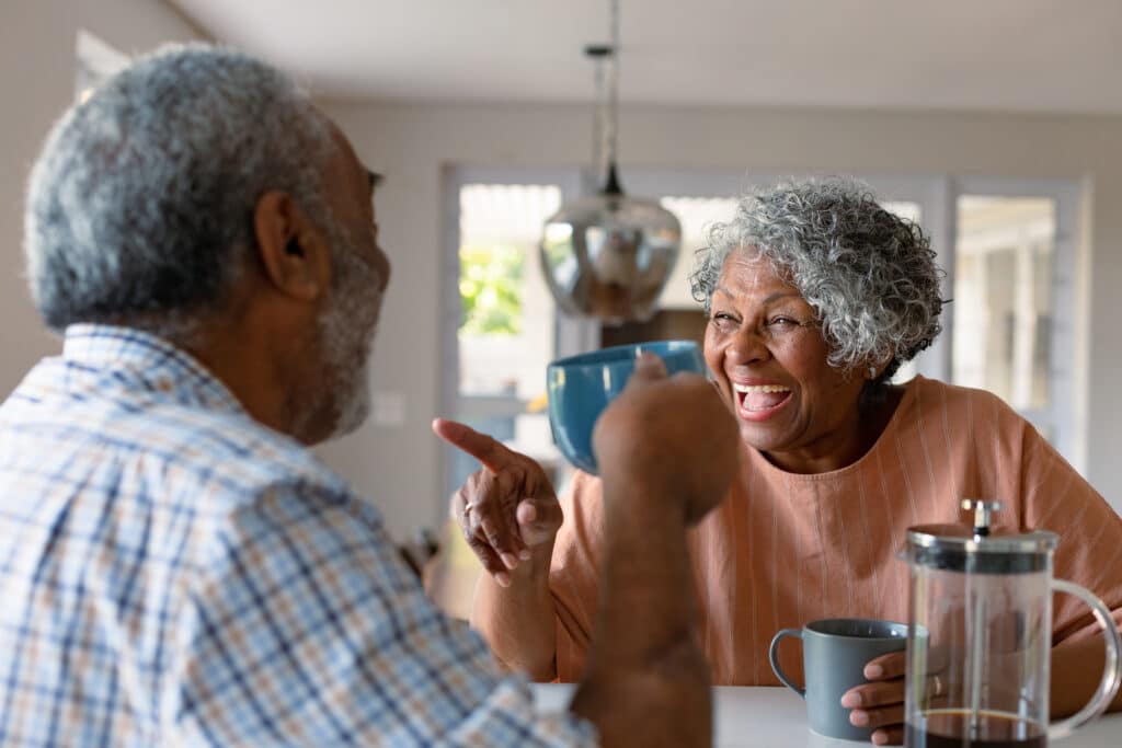 senior couple happy after reverse mortgage counseling