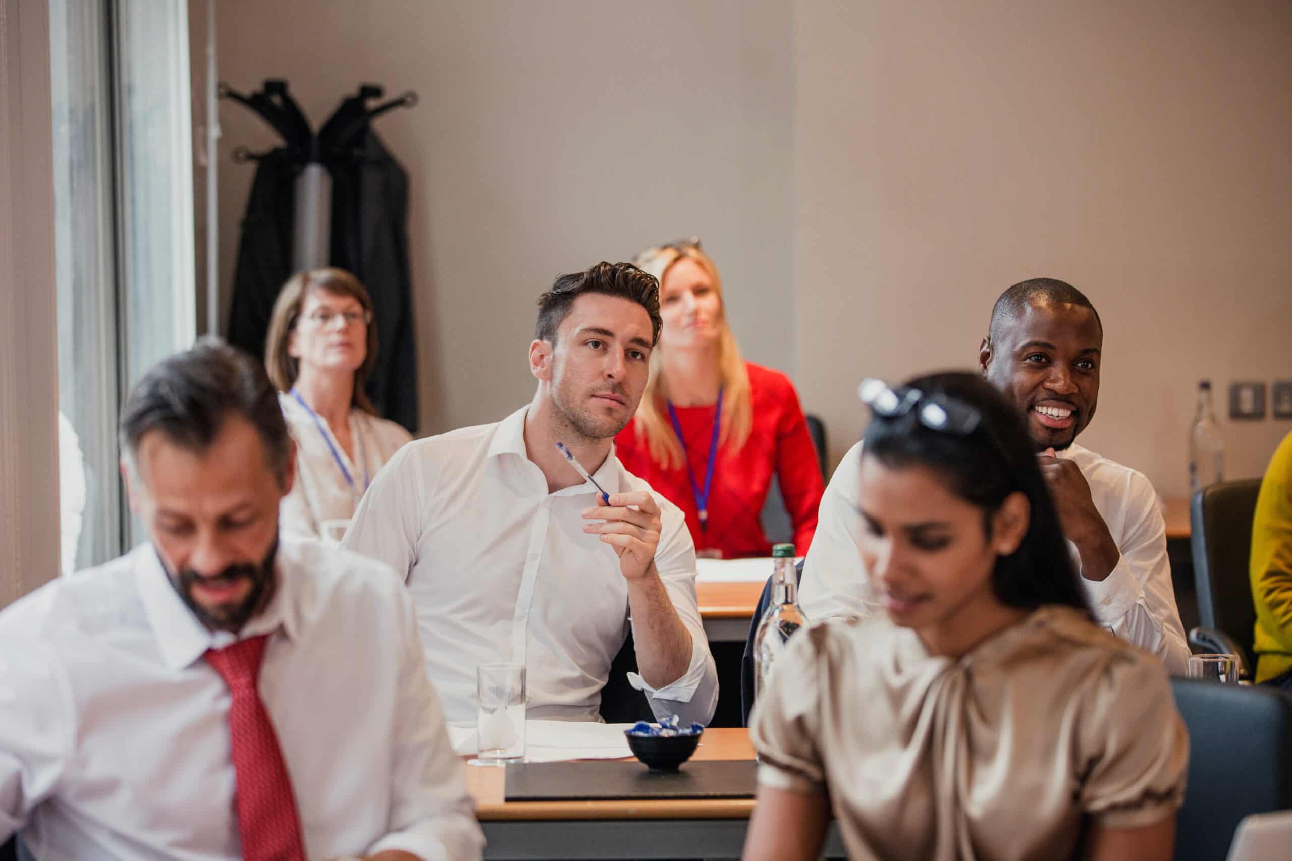 Employees participating in a meeting about financial wellness resources