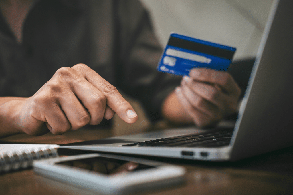 man paying off his credit card debt with credit counseling