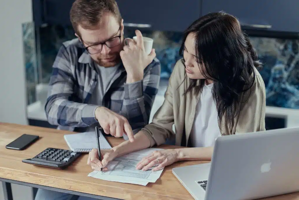 Couple creating a debt repayment plan and feeling optimistic about the future