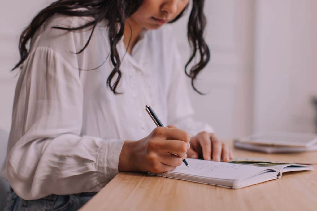 Woman reviewing household expenses and looking for ways to save money