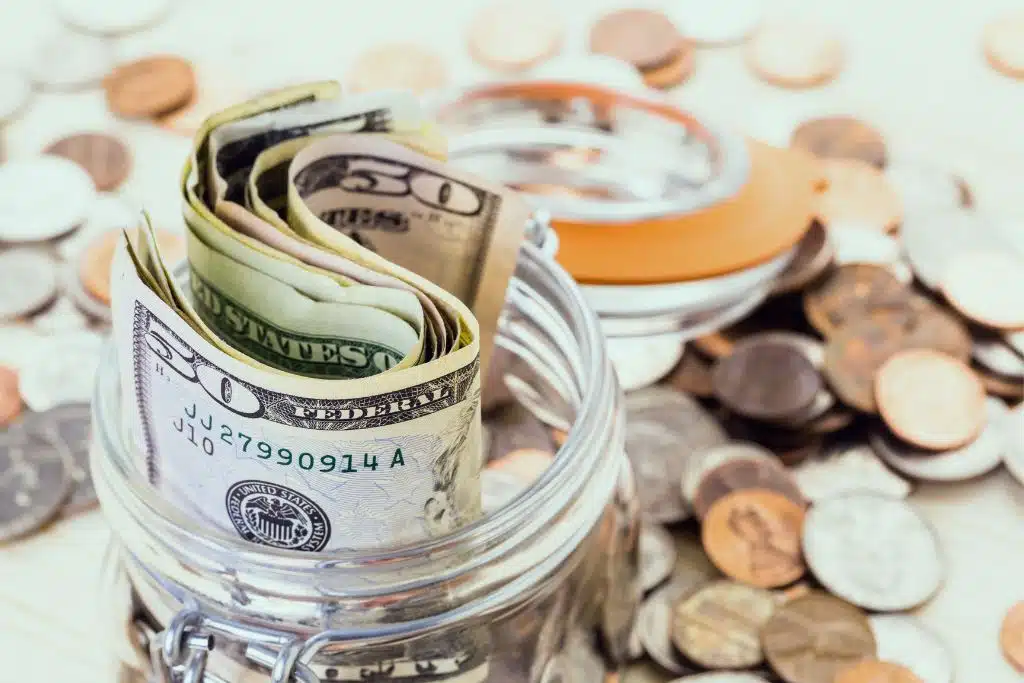 Man checking his savings account and feeling relieved about his emergency fund