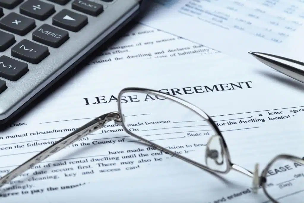 Young renter reviewing a lease agreement before signing