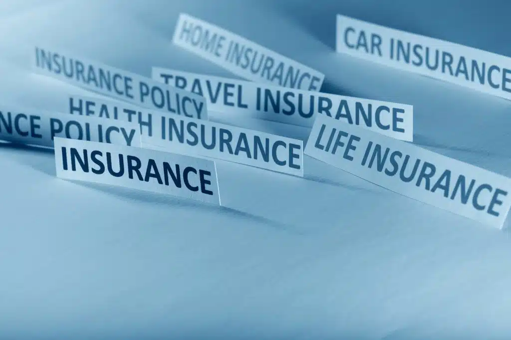 Woman reading insurance paperwork and highlighting important terms