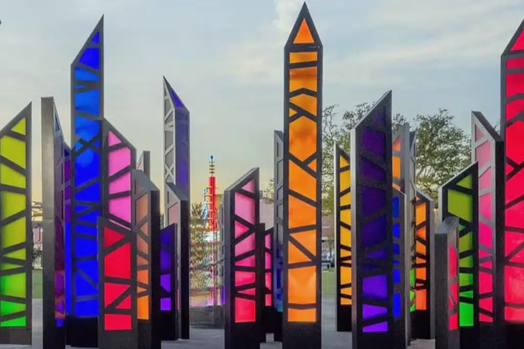 Colorful illuminated spires in downtown Garland, Texas at dusk