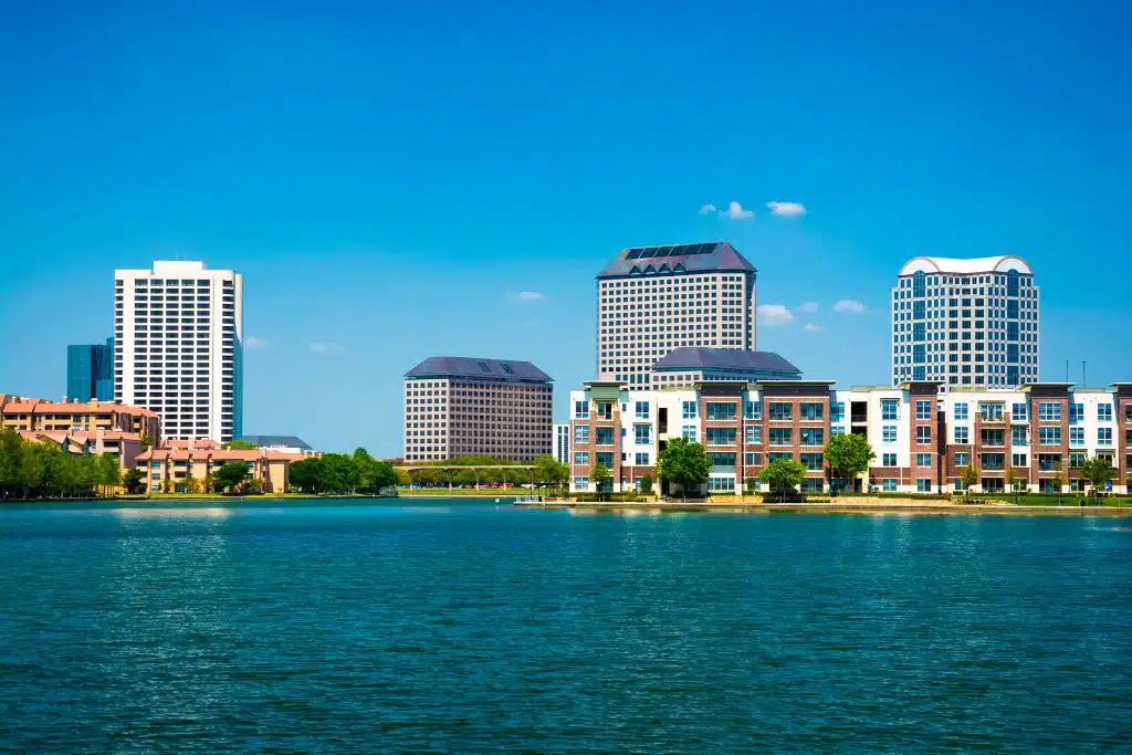 Irving, Texas skyline with water in the foreground on a clear day