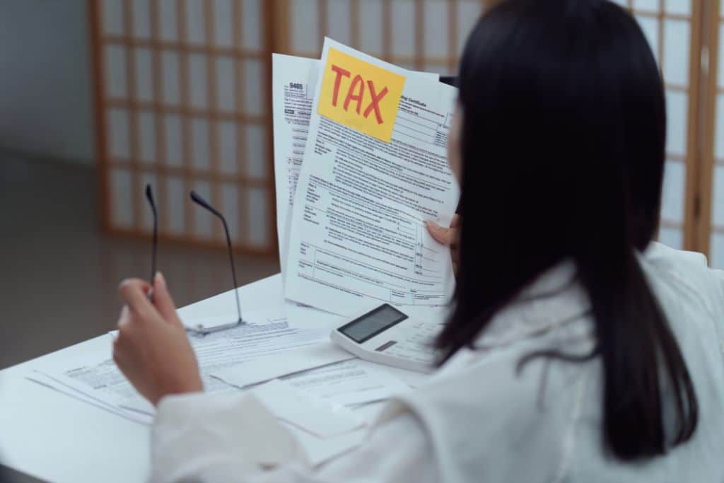 woman reviewing taxes in preparation of filing